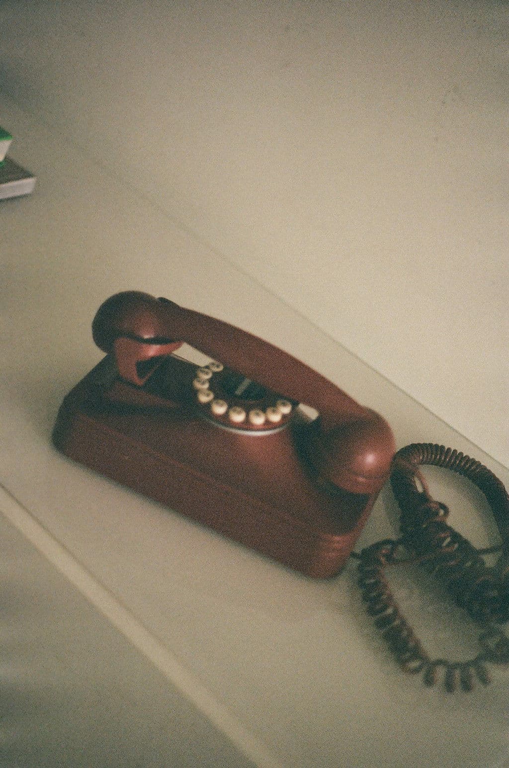 Vintage rotary telephone on a neutral surface